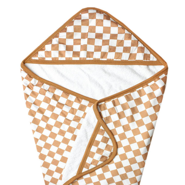 Hooded towel with brown and white checkered pattern on a white background